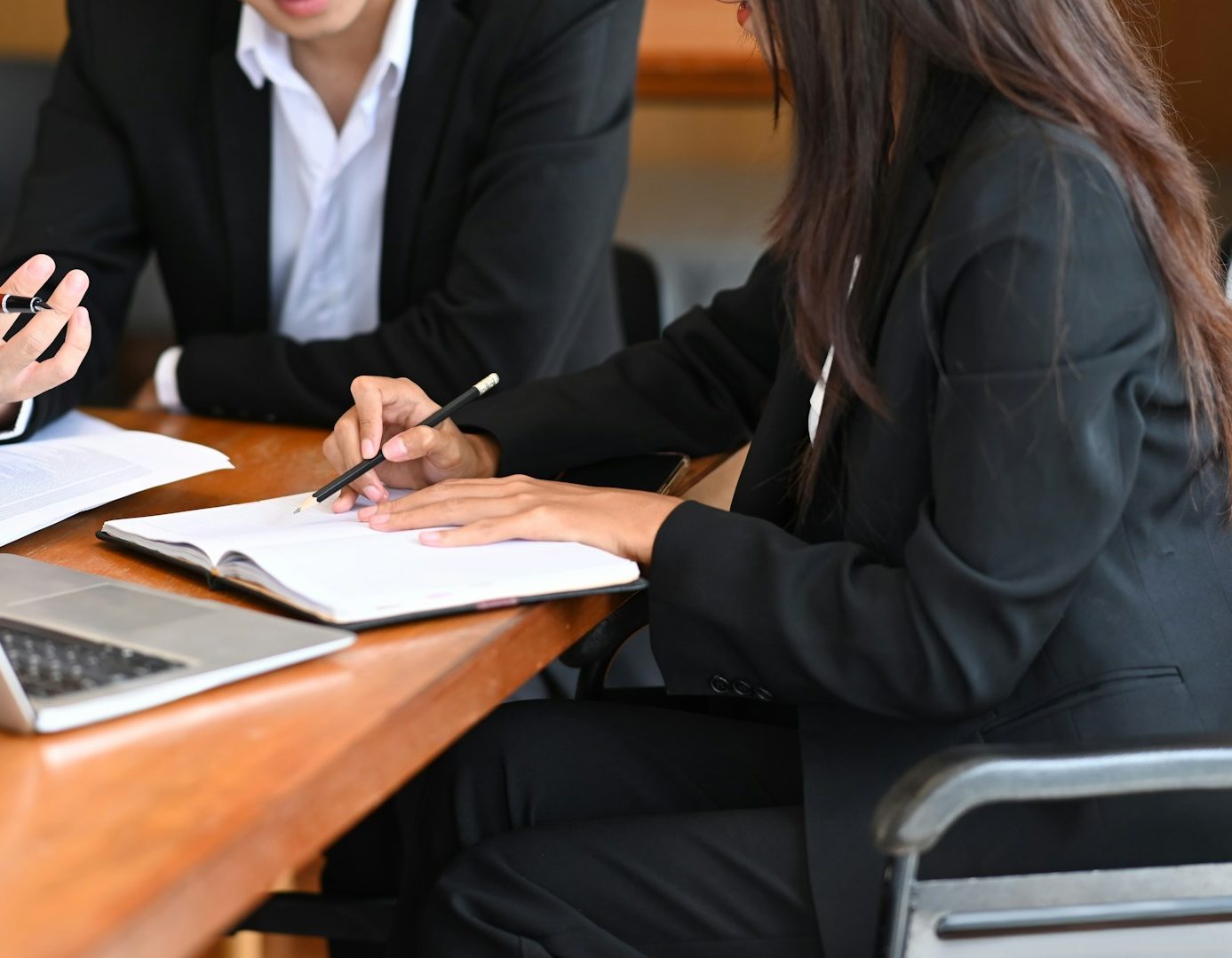 two people filling out paperwork two people filling out paperwork